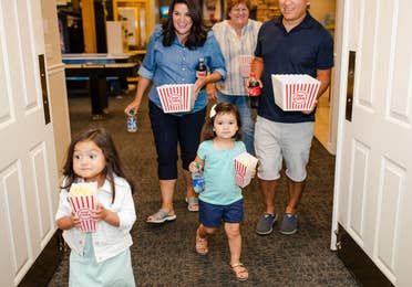 Family of five going to view a movie at Holiday Hills Resort in Branson, Missouri.