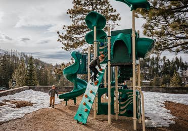 Children playing on outdoor playground at Tahoe Ridge Resort in Stateline, Nevada