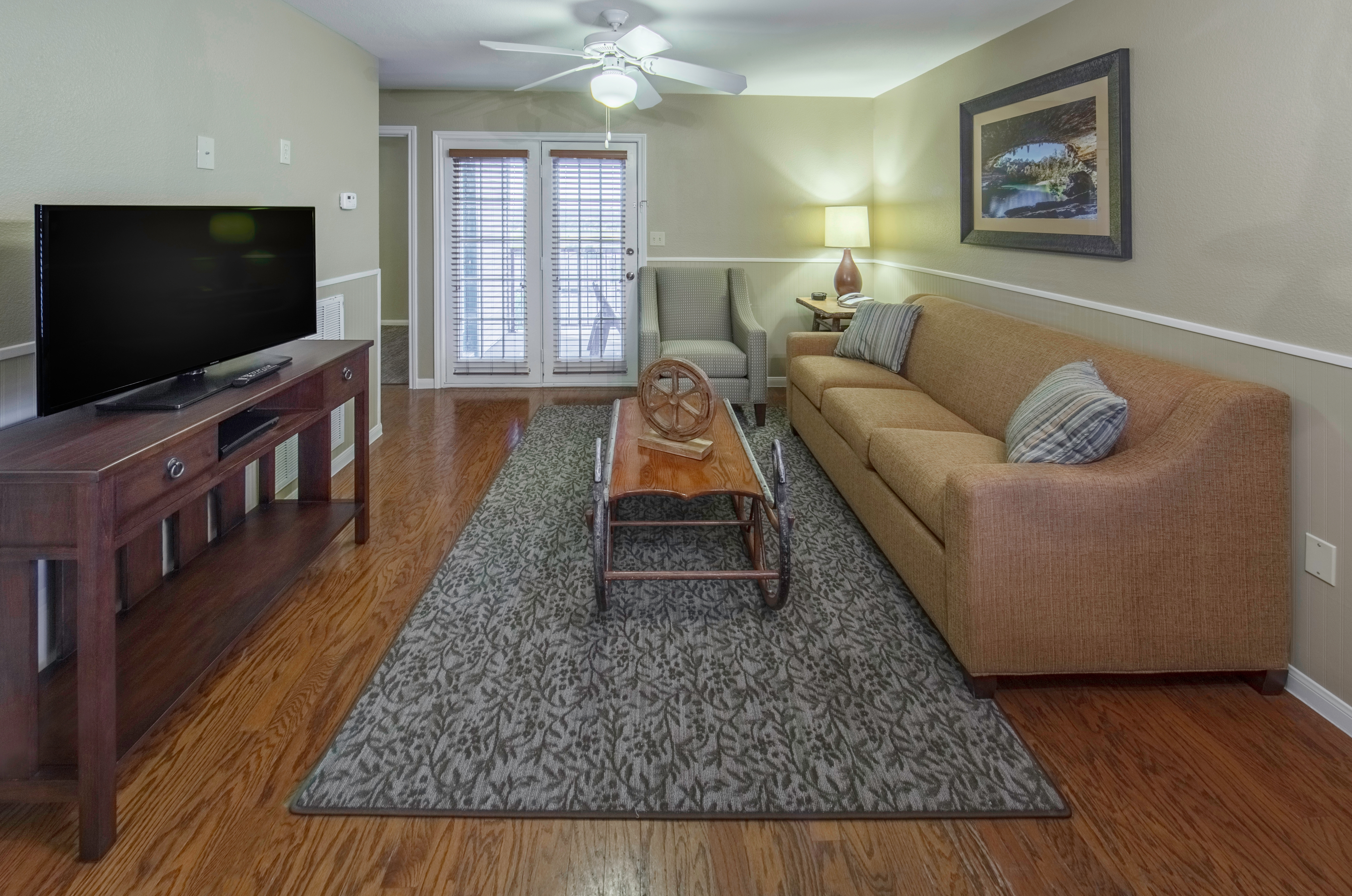 Living room and entertainment center in a three-bedroom ambassador villa at the Hill Country Resort in Canyon Lake, Texas.