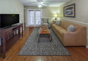 Living room and entertainment center in a three-bedroom ambassador villa at the Hill Country Resort in Canyon Lake, Texas.
