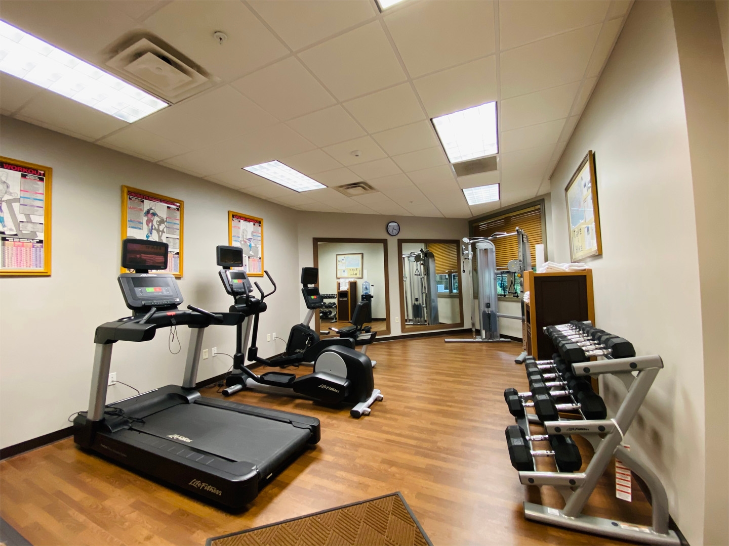 Fitness center with a treadmill, stationary bicycle, elliptical and free weights at Smoky Mountain Resort in Gatlinburg, Tennessee.