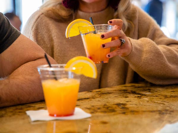 Two adults having drinks.
