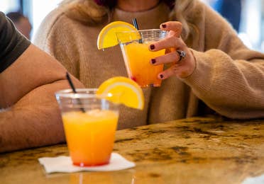 Two adults having drinks.