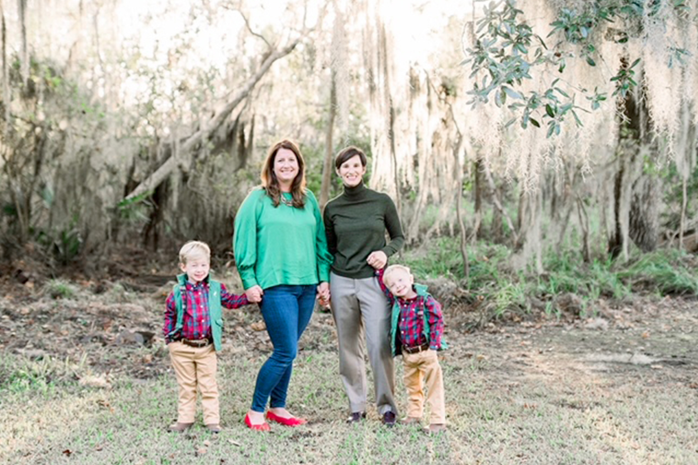 Featured Contributor, Catherine Karas (left), and her family stand outdoors.