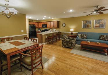 Living, kitchen and dining areas in a villa at Orlando Breeze Resort.