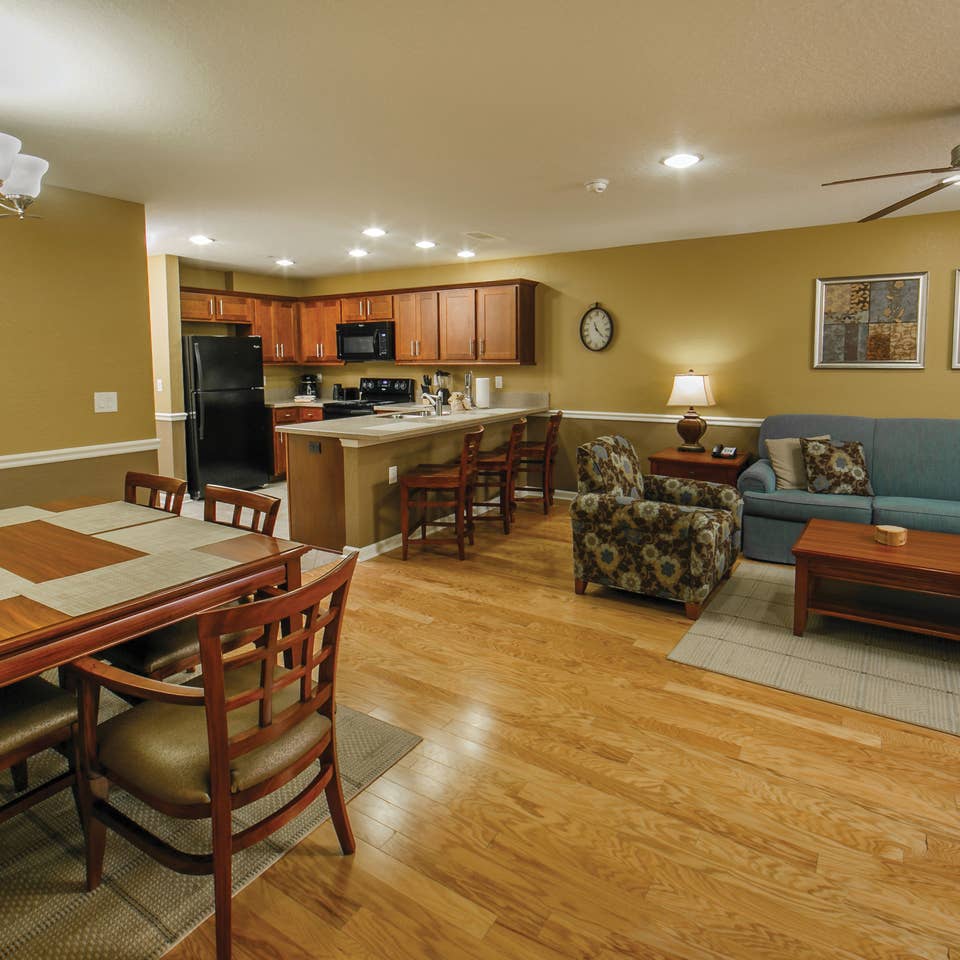 Living, kitchen and dining areas in a villa at Orlando Breeze Resort.