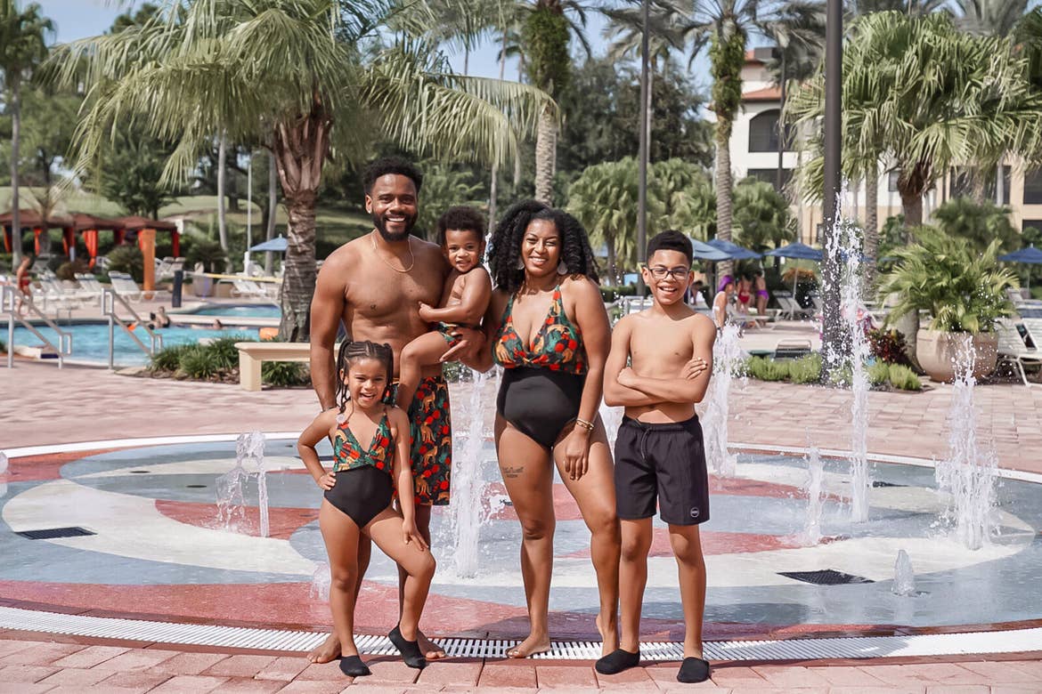 Featured Contributor, Tina Meeks, stands with her husband, daughter and sons in matching swimming apparel near our pool at our Orange Lake resort in Orlando, Florida.