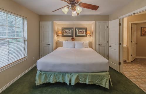 Bedroom in a villa at Holly Lake Resort in Holly Lake Ranch, Texas.