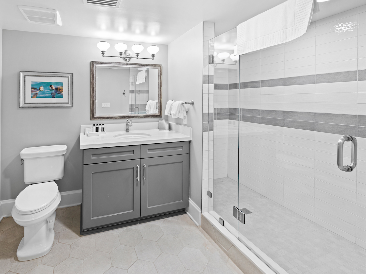 Bathroom with walk-in shower in a four-bedroom Signature Collection villa at Cape Canaveral Resort.