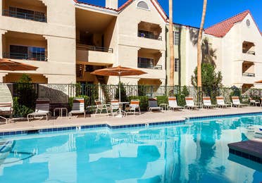 Pool with seating at Desert Club Resort.
