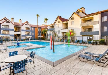 Pool with seating at Desert Club Resort.