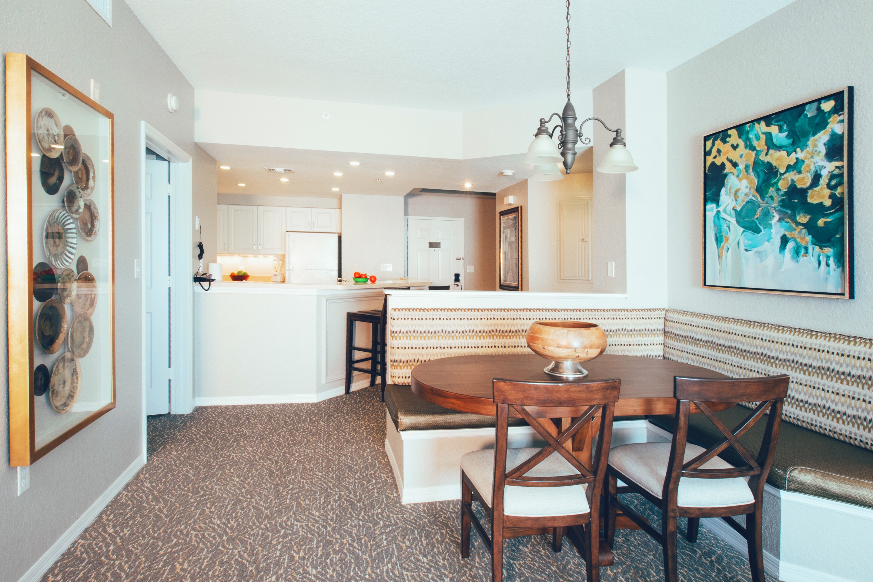Dining area and full kitchen in background in villa in River Island at Orange Lake Resort near Orlando, Florida