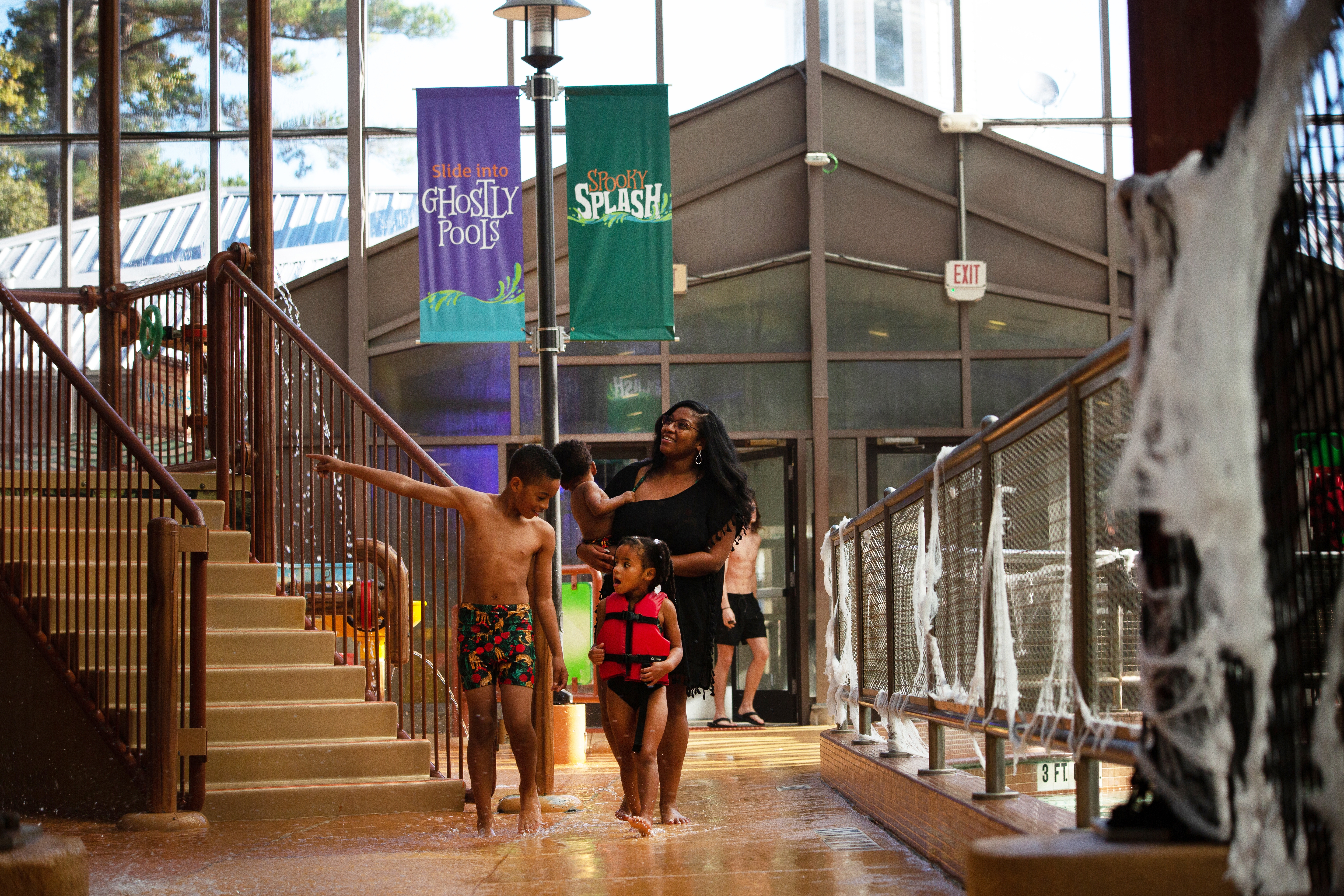 Tina and her kids walking through the Waterpark at the Villages