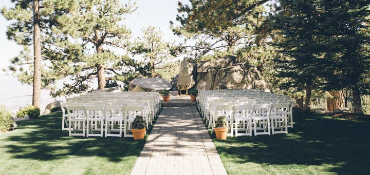White chairs set up for a wedding ceremony