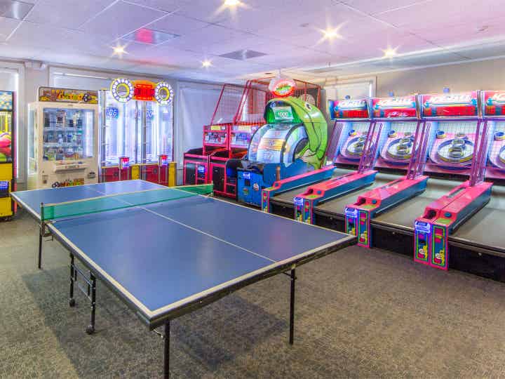 Game room with ping pong table at Oak n Spruce Resort.