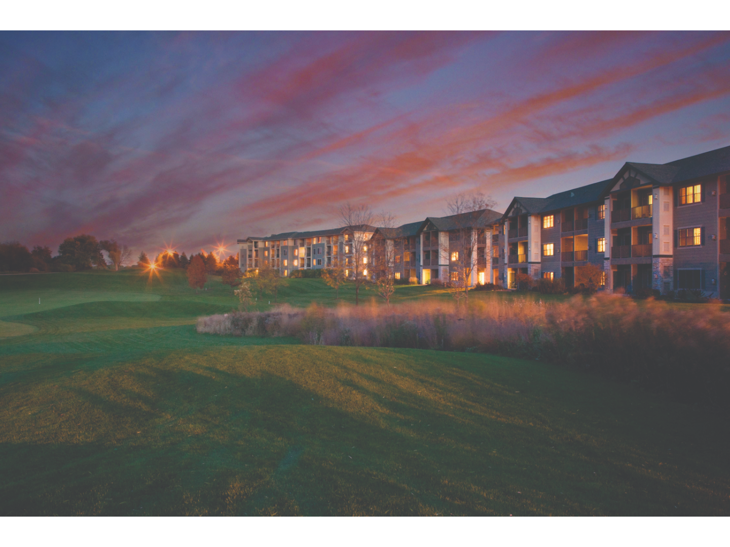 Exterior view of Lake Geneva resort, showing the villa buildings on the golf course.