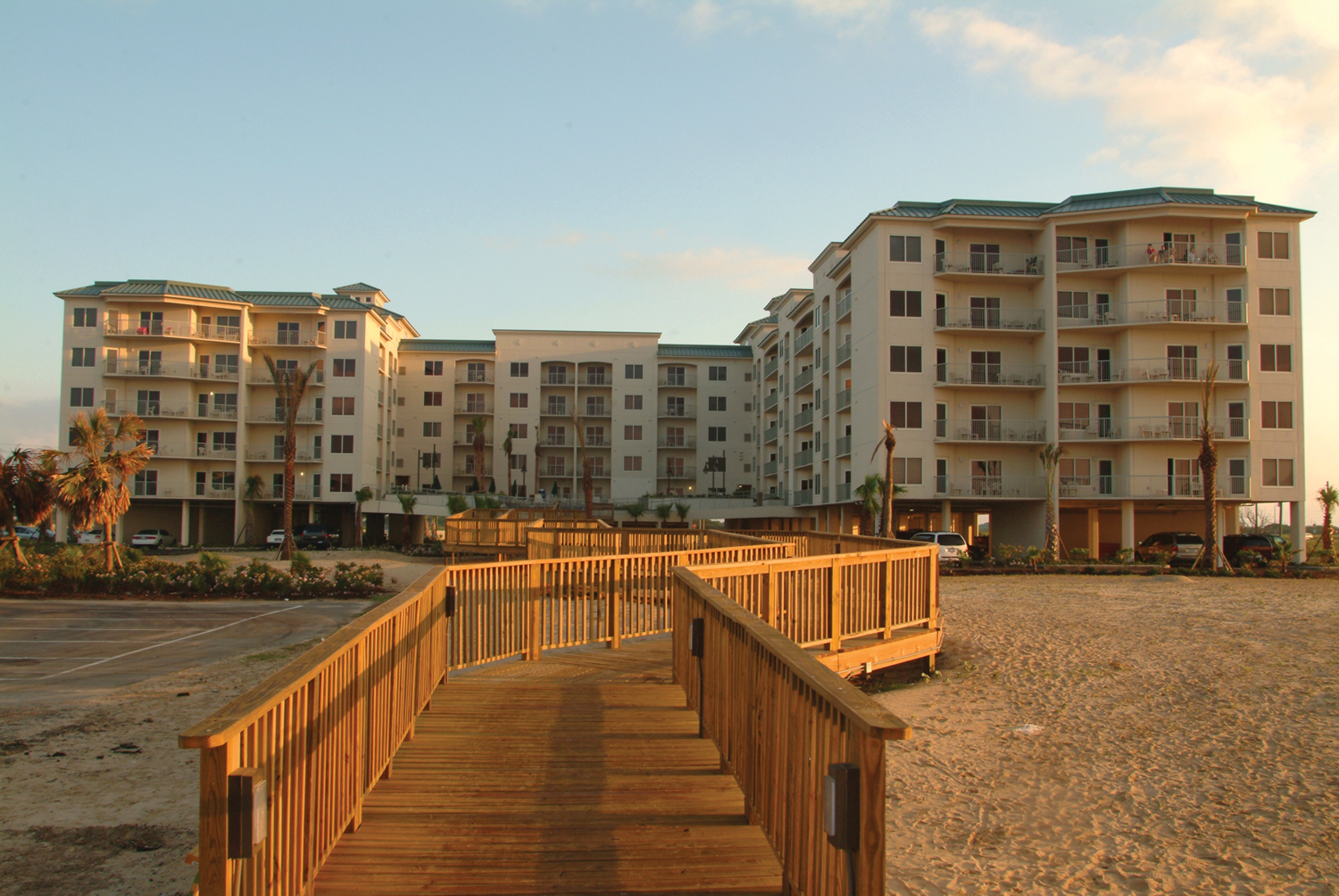 Exterior of Galveston Beach Resort at sunset.
