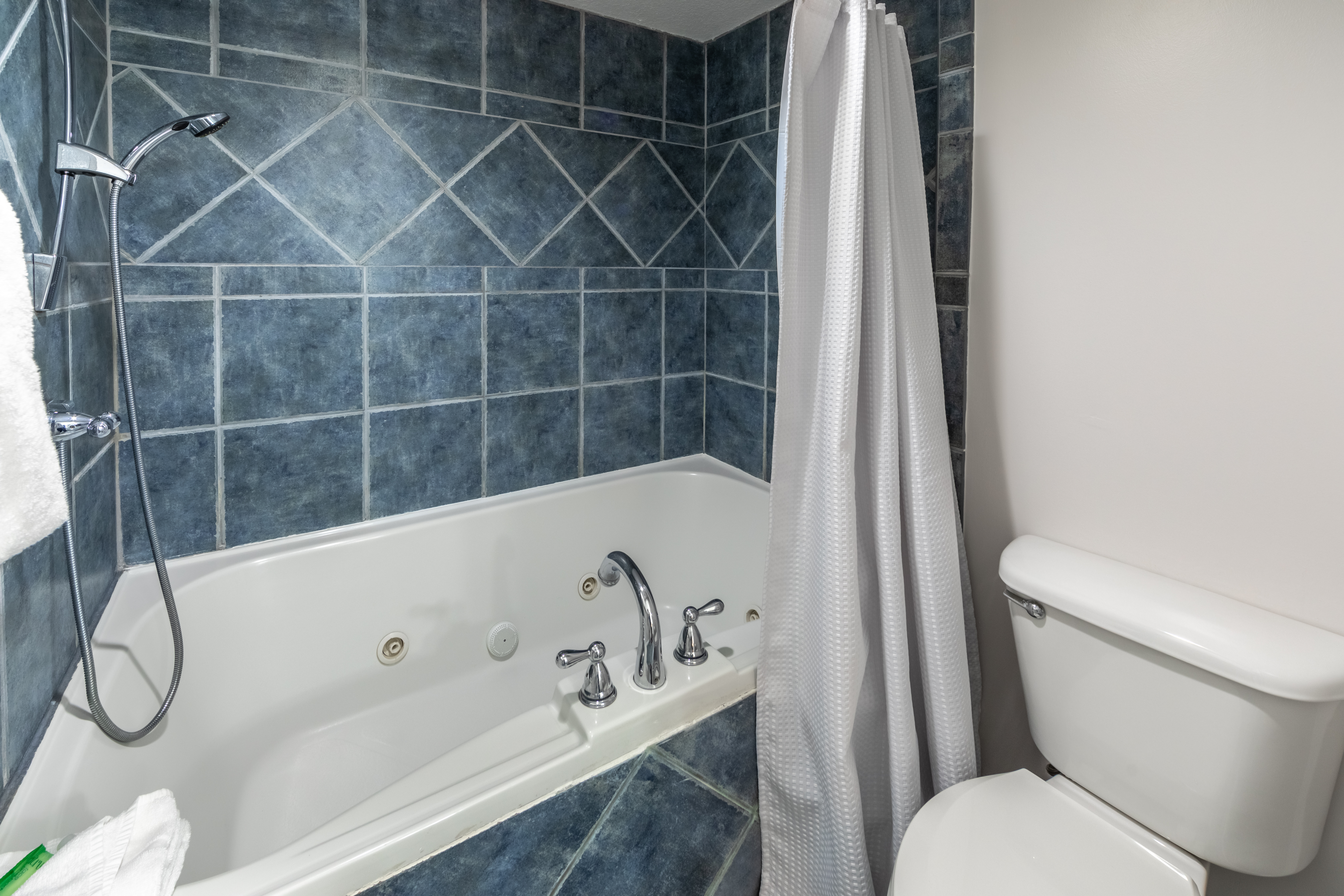 Whirlpool tub and shower combination in a one-bedroom villa at Panama City Beach Resort