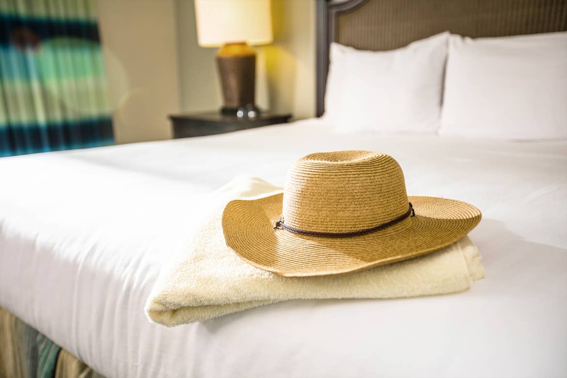 A straw sunhat places in the master bedroom in our villa at South Beach Resort in Myrtle Beach, SC.