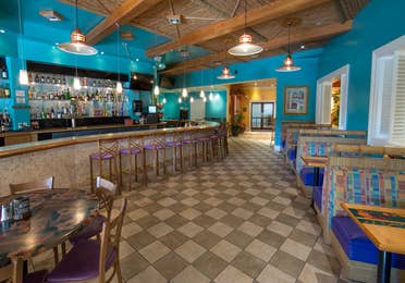 Indoor bar and restaurant seating at Cape Grill & Bar at Cape Canaveral Beach Resort.
