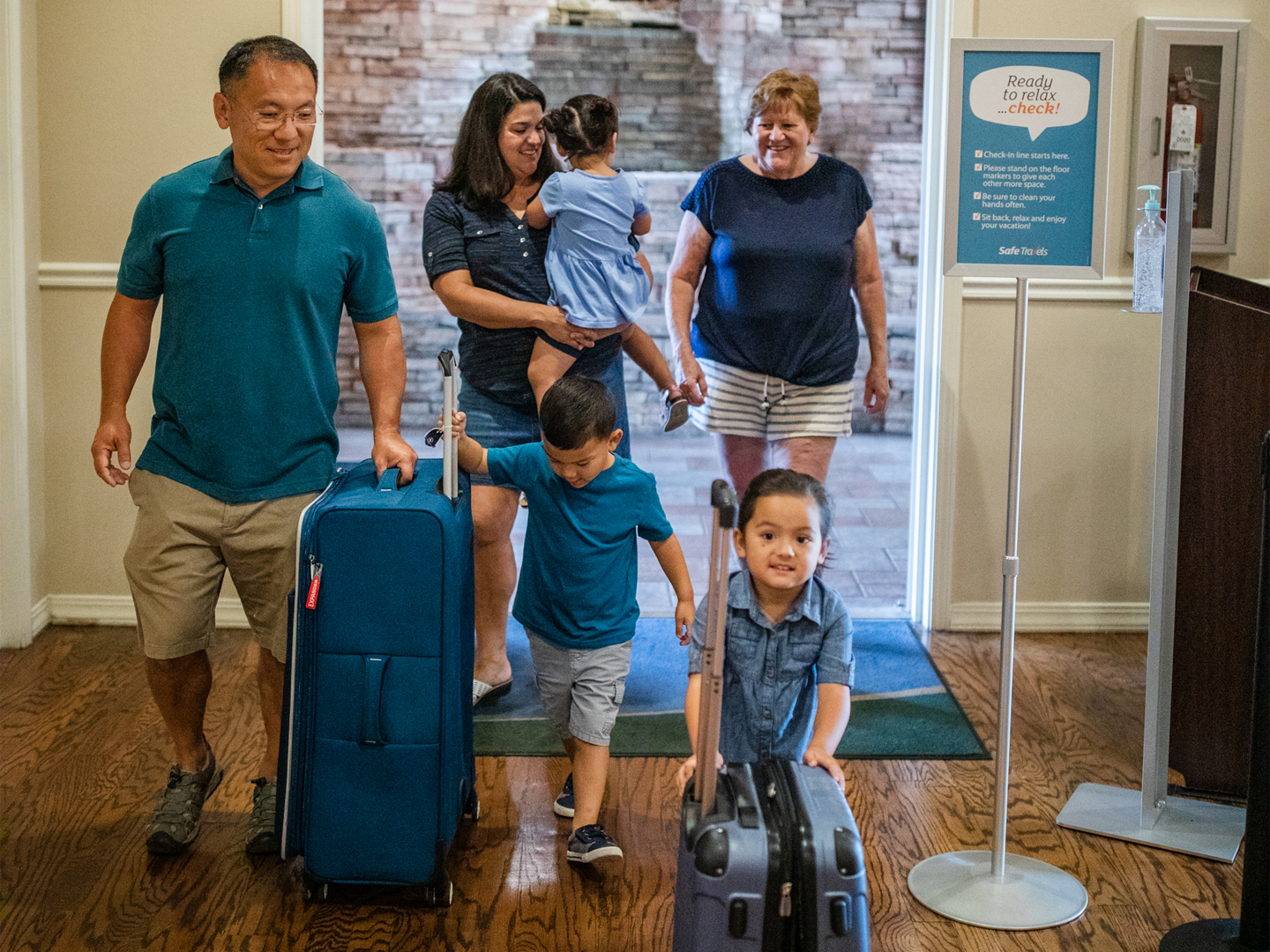 Family of six checking into a Holiday Inn Club Vacations resort.
