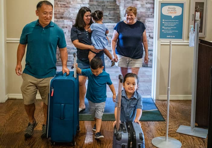 Family of six checking into a Holiday Inn Club Vacations resort.