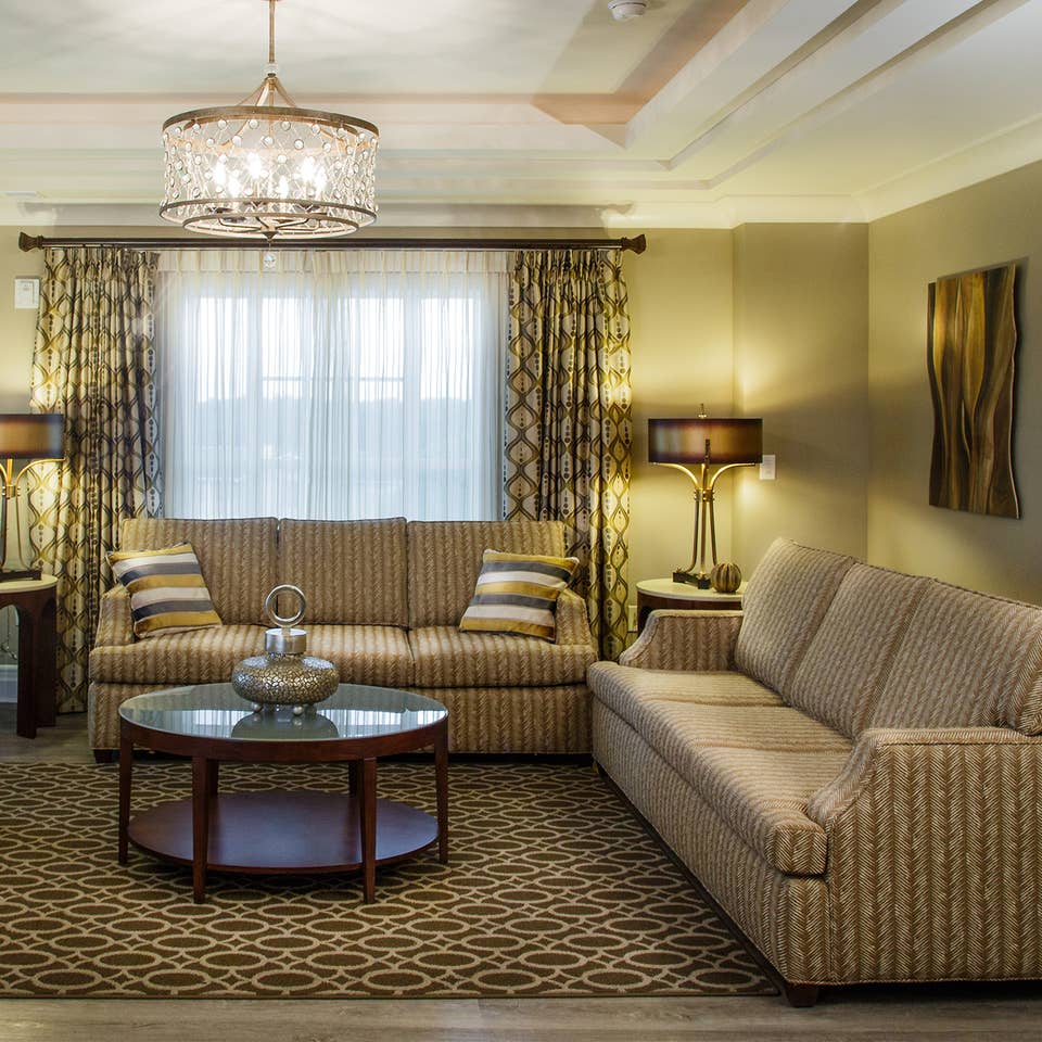 Two couches in a living room in a three-bedroom Signature Collection villa at South Beach Resort in Myrtle Beach, South Carolina.