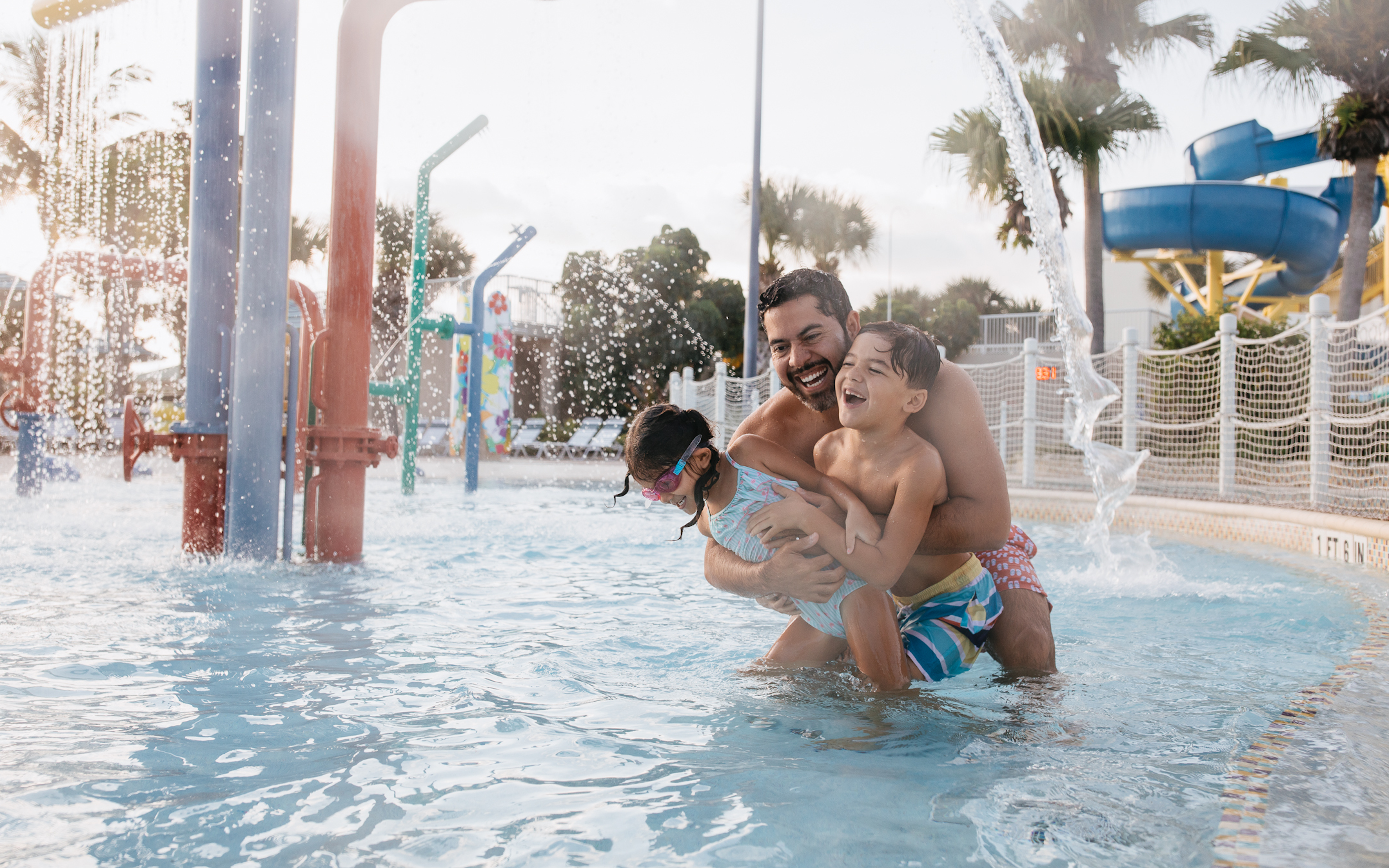 Family in pool at Cape Canaveral Beach Resort in Florida.