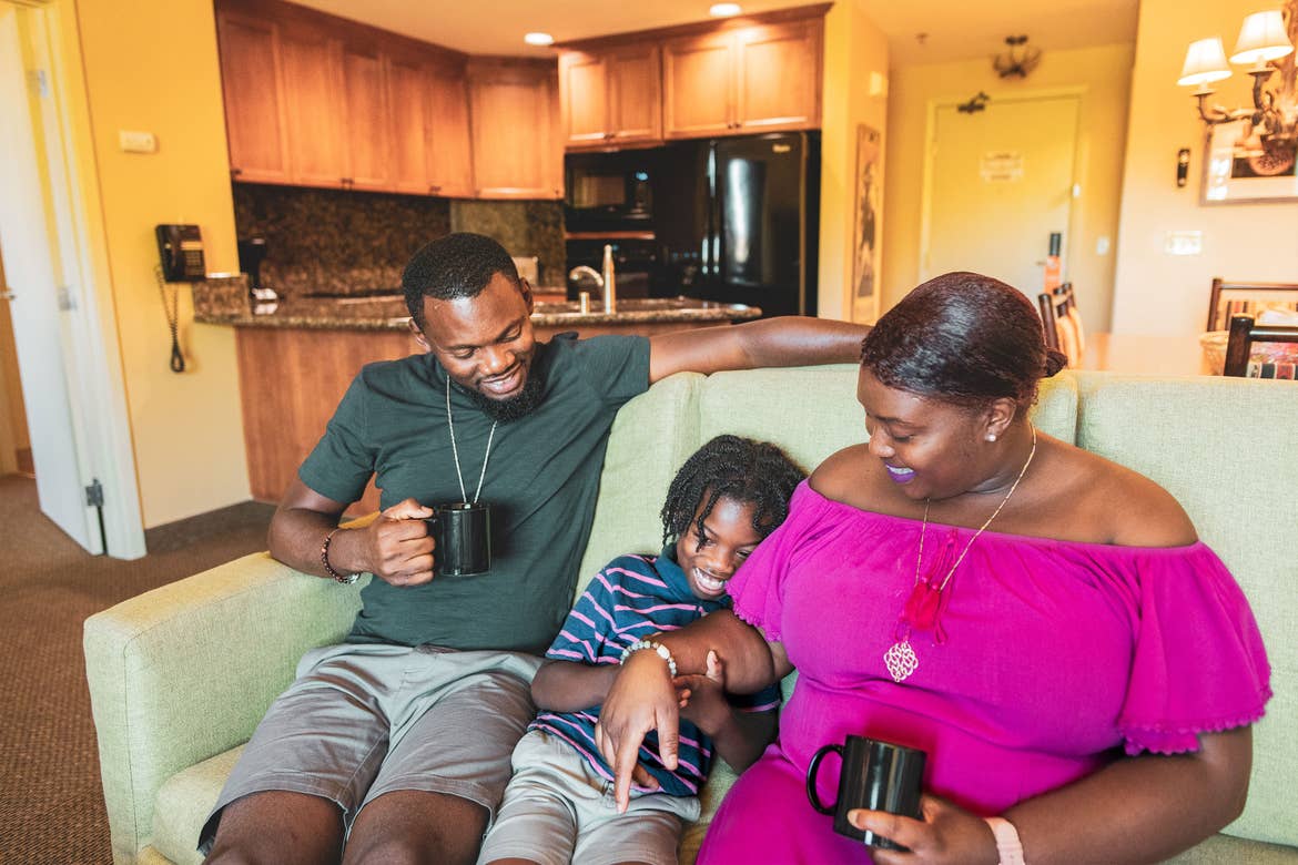 Karen Akpan (right) enjoying coffee at our in their Lake Tahoe Resort villa with her husband (left) and son (middle).