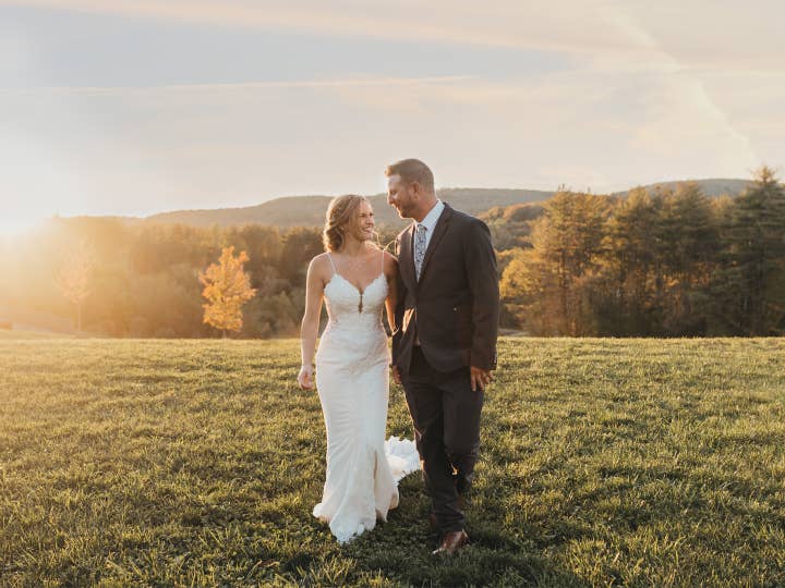 Bride and groom standing on hill after a wedding at Mount Ascutney Resort in Brownsville, Vermont.