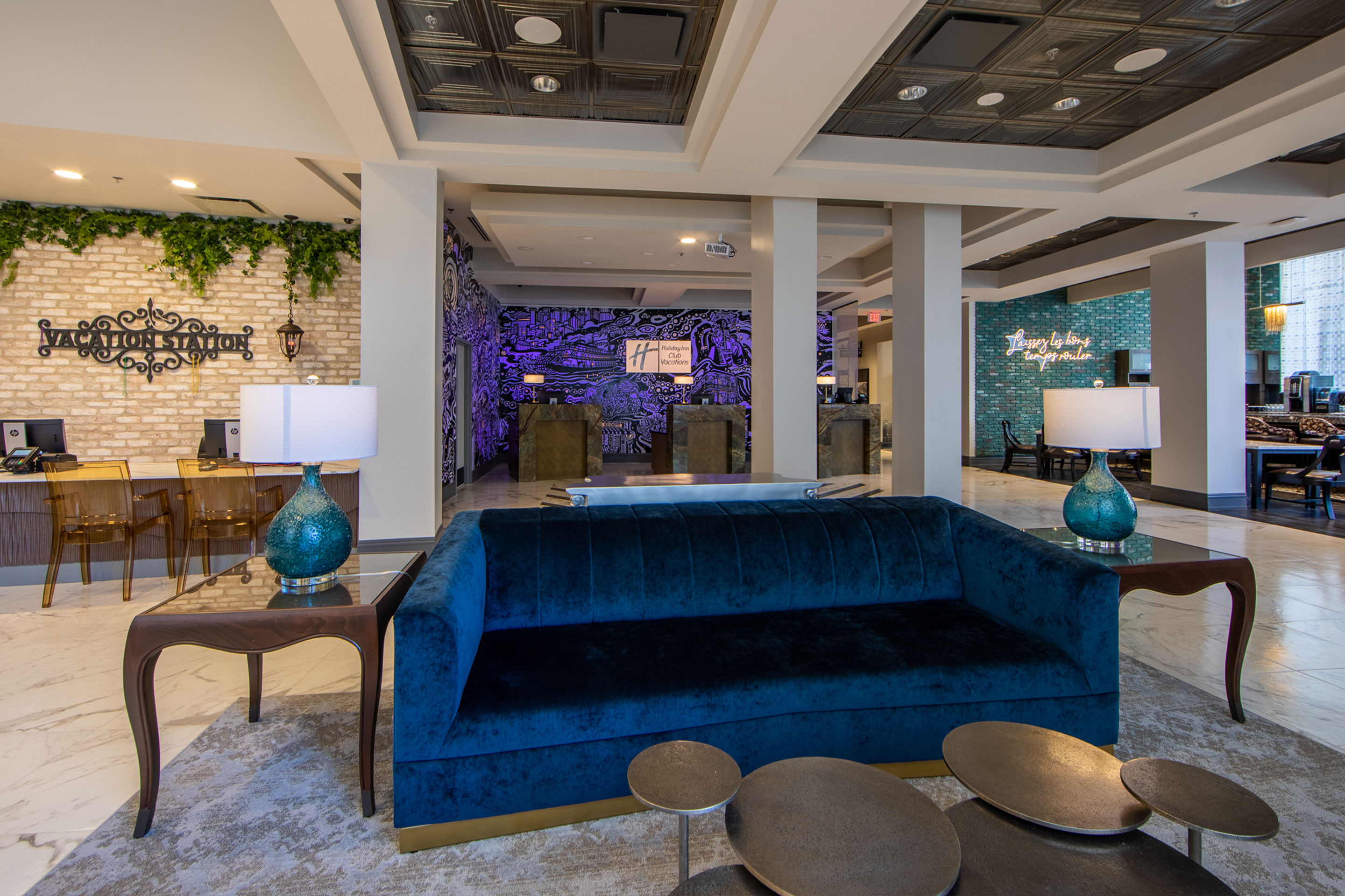 A mural with animated projection mapping in various colors of purple, orange, yellow and magenta featured in the lobby of our resort in New Orleans, Louisiana.