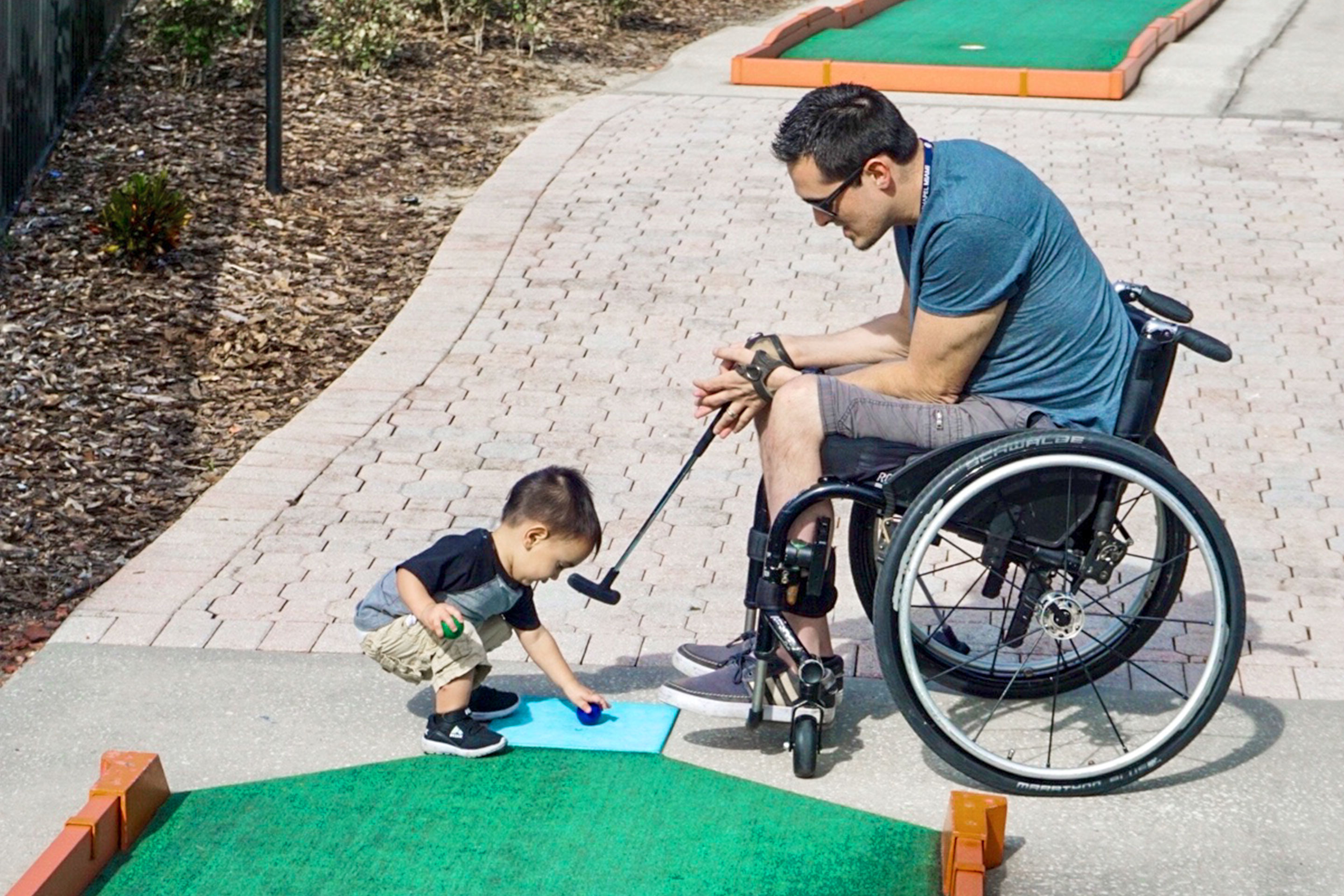 Author, Danny Pitaluga (right), and son, Joey (left), tee up at the mini-golf course located at our Orange Lake Resort located in Orlando, Florida.