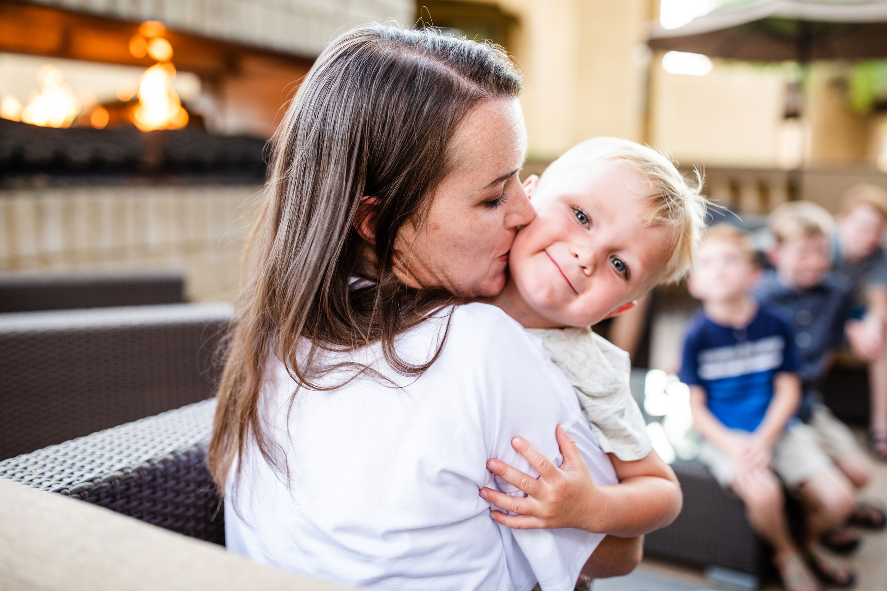Author, Jessica Averett (left), holds her youngest son on the patio of our Scottsdale Resort.