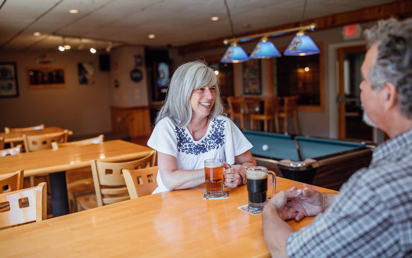 Couple having drinks at Beartree Bar at Oak n' Spruce Resort in South Lee, Massachusetts.