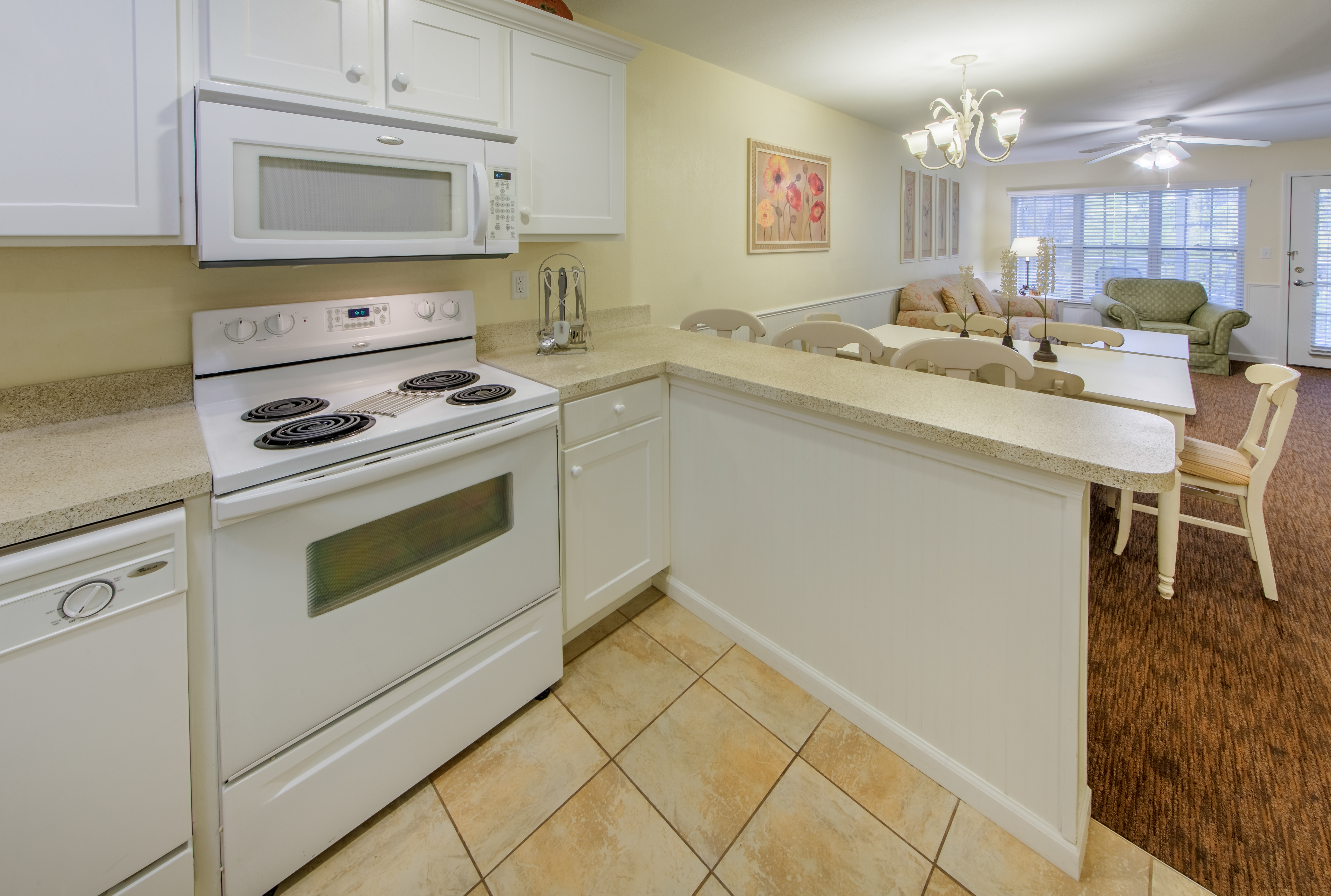 Kitchen with a view of the dining room and family room
