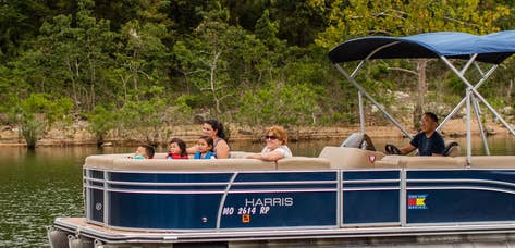 Boat on catch-and-release pond at Holiday Hills Resort in Branson, Missouri.