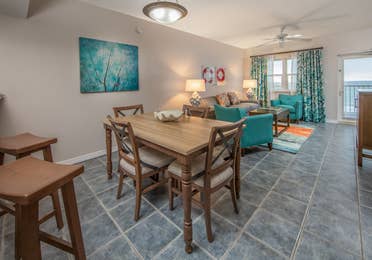 Dining room and table in a one-bedroom villa at Panama City Beach Resort