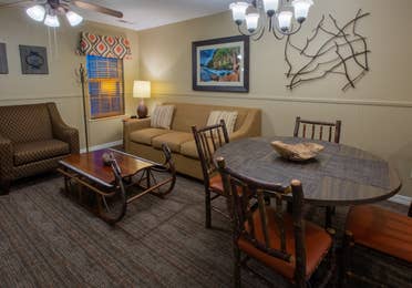Living room and dining area in a two-bedroom villa at Timber Creek Resort
