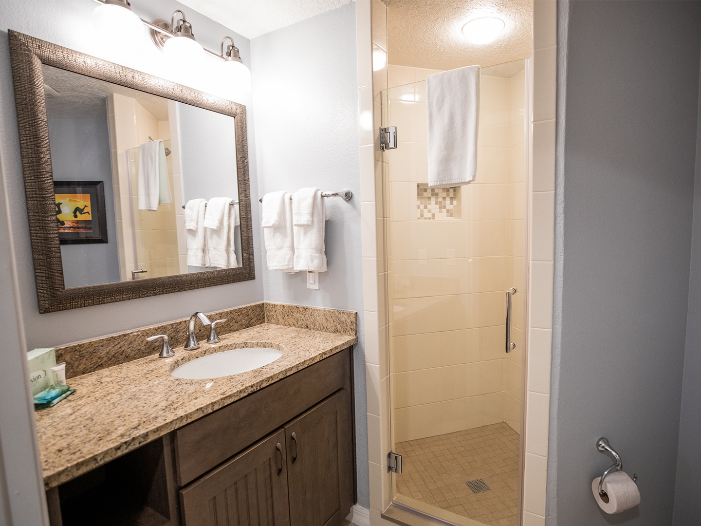 Bathroom with vanity and shower in a villa at Cape Canaveral Beach Resort.