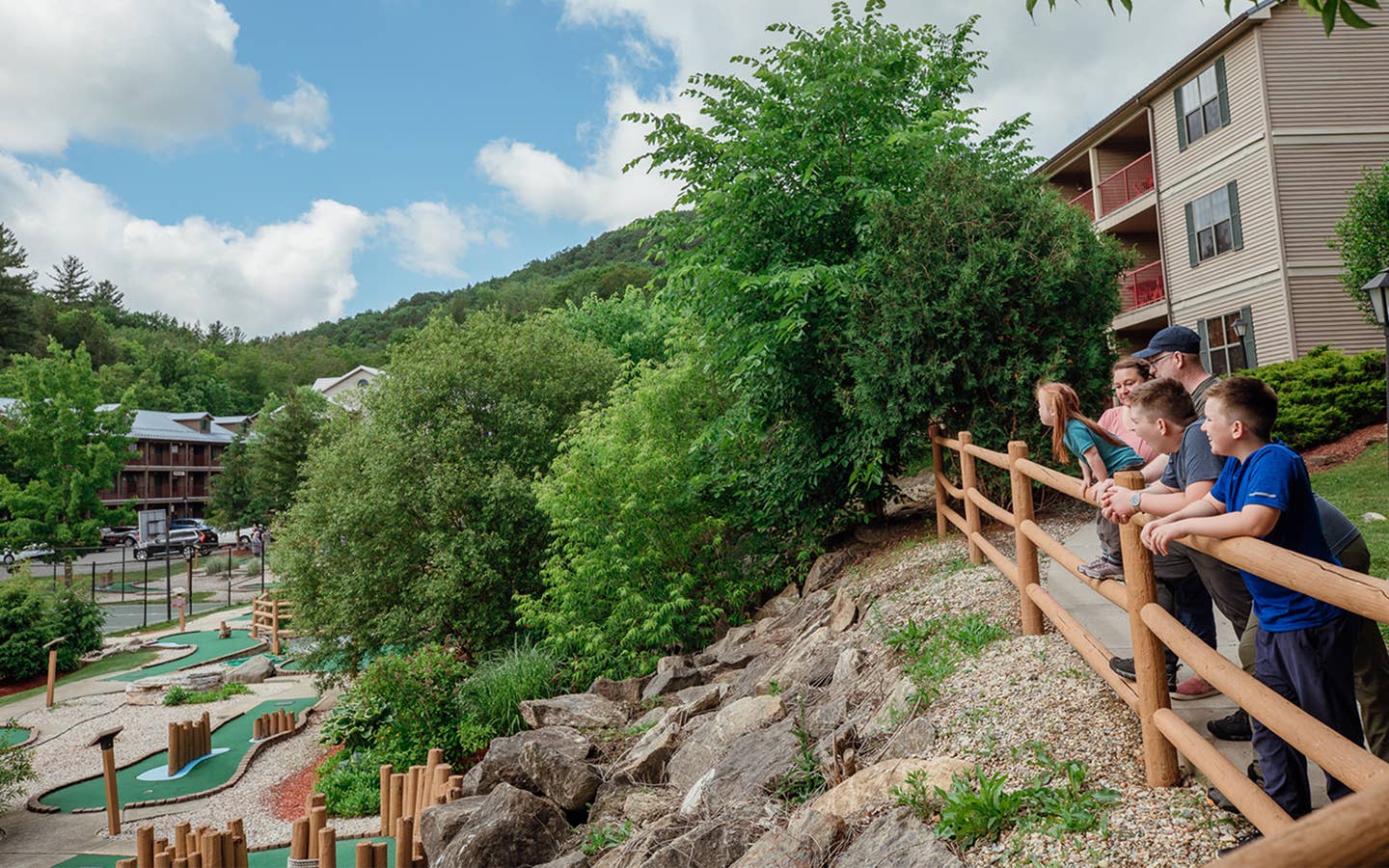 Family enjoying the outdoors at Oak n' Spruce Resort in South Lee, Massachusetts.