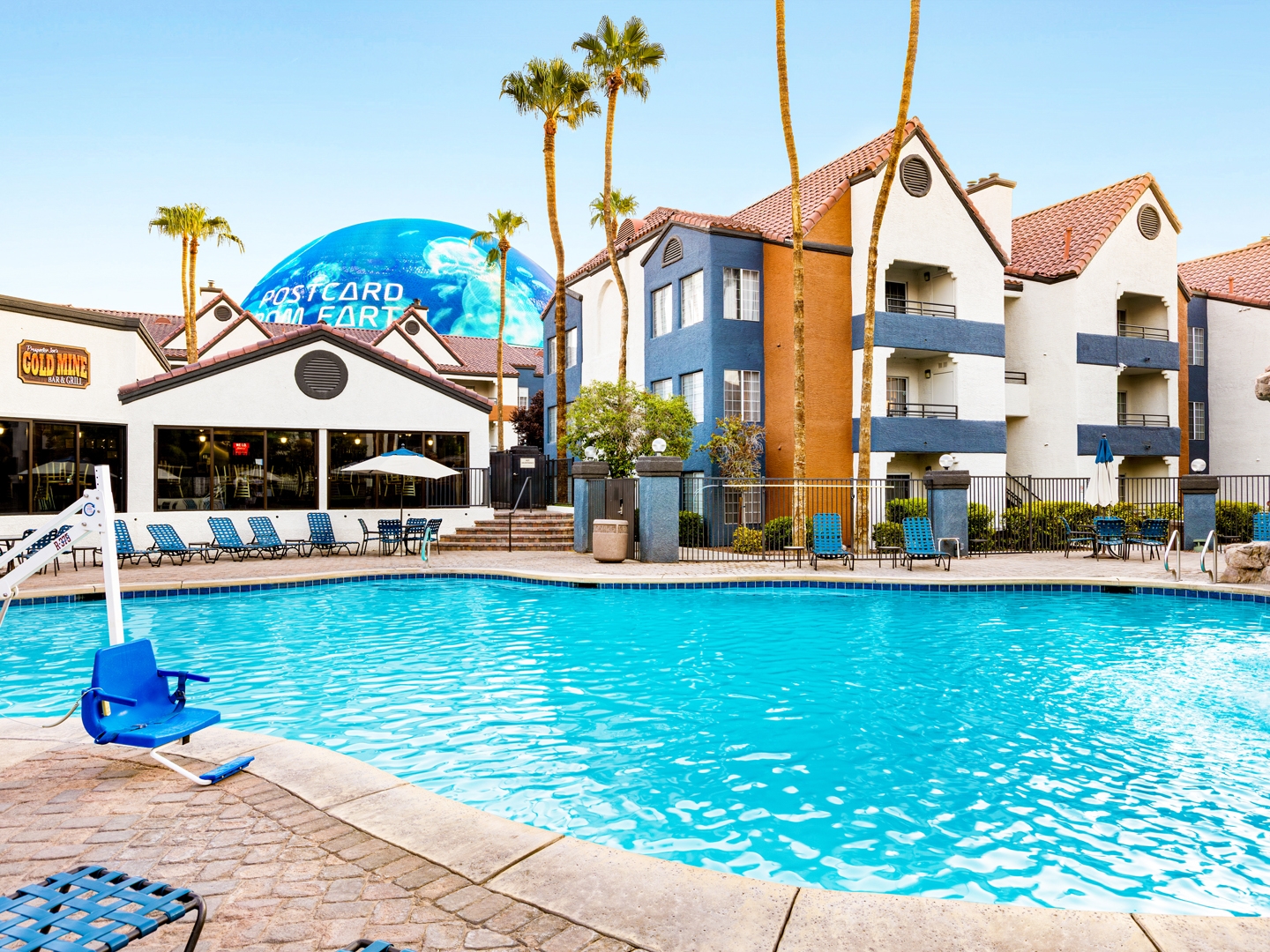 Outdoor pool with view of the Sphere at Desert Club Resort. 