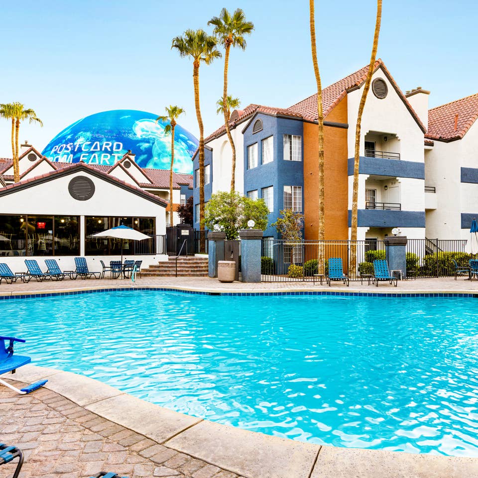 Outdoor pool with view of the Sphere at Desert Club Resort.