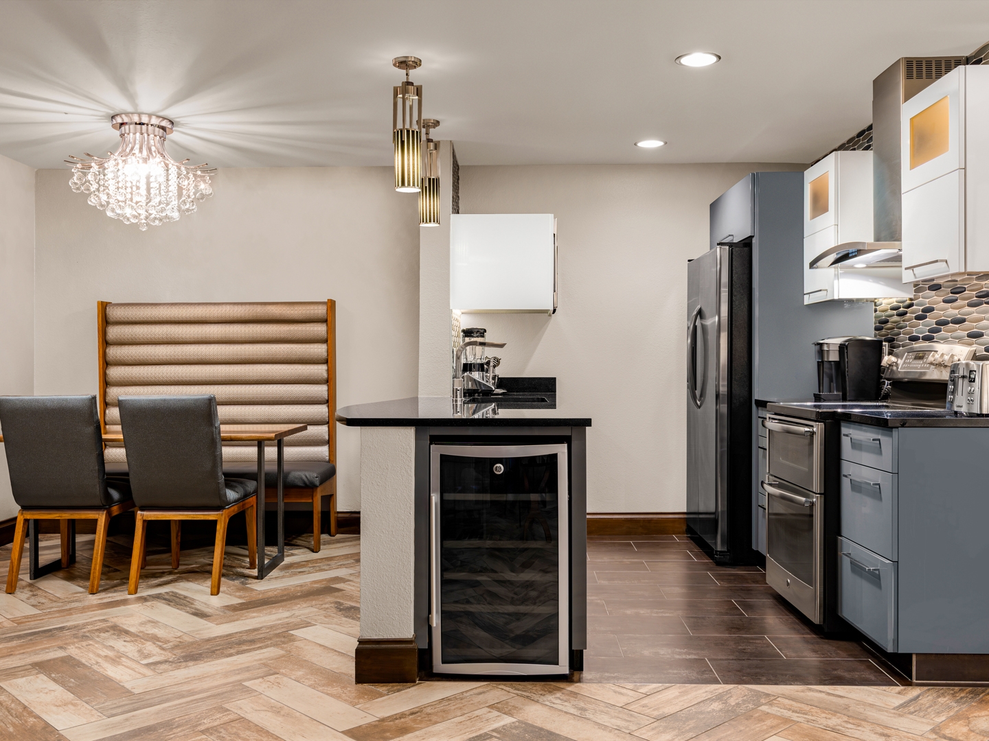 Modern kitchen and dining area with stone accents.
