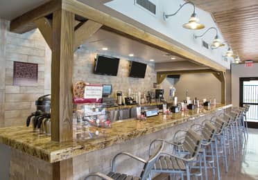 Bar seating in Gold Mine Bar & Grill at Desert Club Resort in Las Vegas, Nevada.