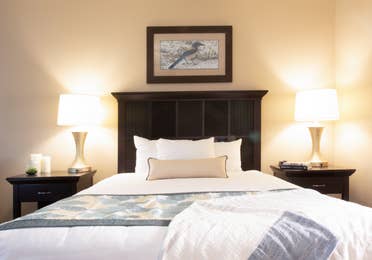 Bed and two nightstands in a three bedroom villa in North Village at Orange Lake Resort near Orlando, Florida