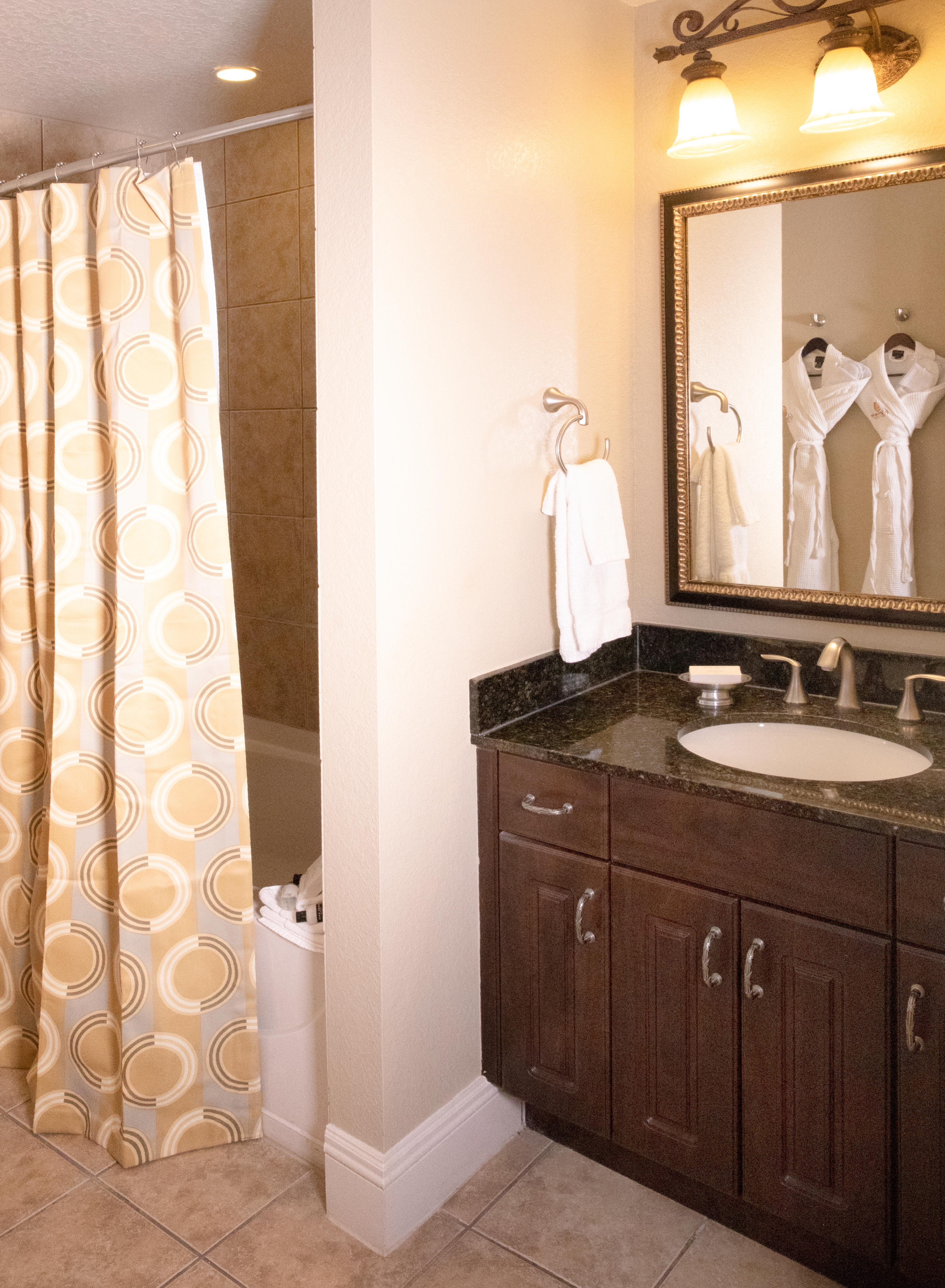 Bathroom with sink, mirror, and shower/tub combination in a Signature villa in River Island at Orange Lake Resort near Orlando, Florida