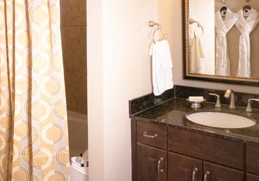 Bathroom with sink, mirror, and shower/tub combination in a Signature villa in River Island at Orange Lake Resort near Orlando, Florida