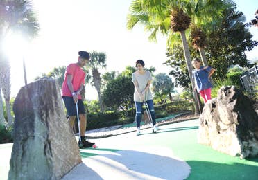 Family enjoying mini golf at Orange Lake Resort near Orlando, Florida