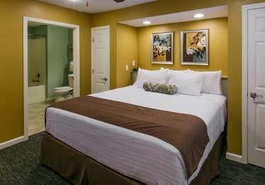 Bed in a villa at Orlando Breeze Resort in Florida.