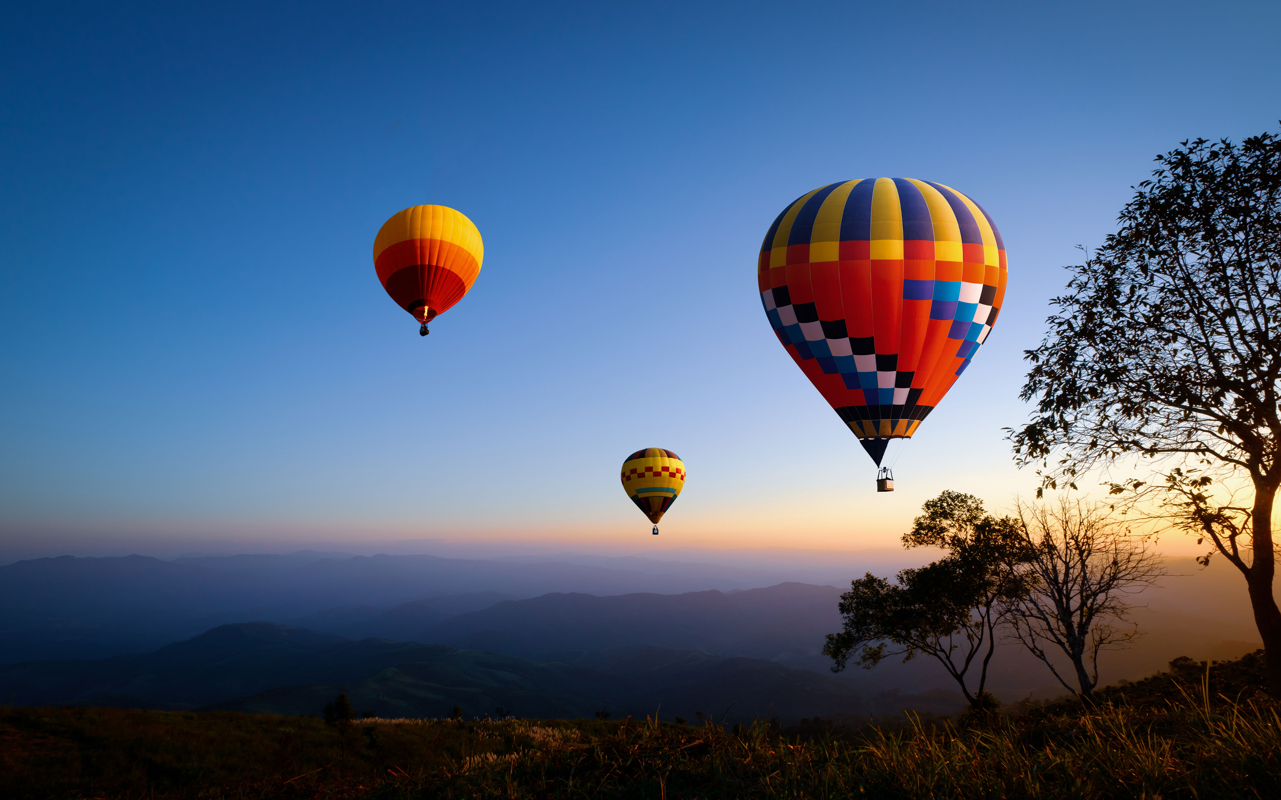 Three hot air balloons in the sky